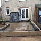 Walls are created, including damp proof membrane, and floor insulated